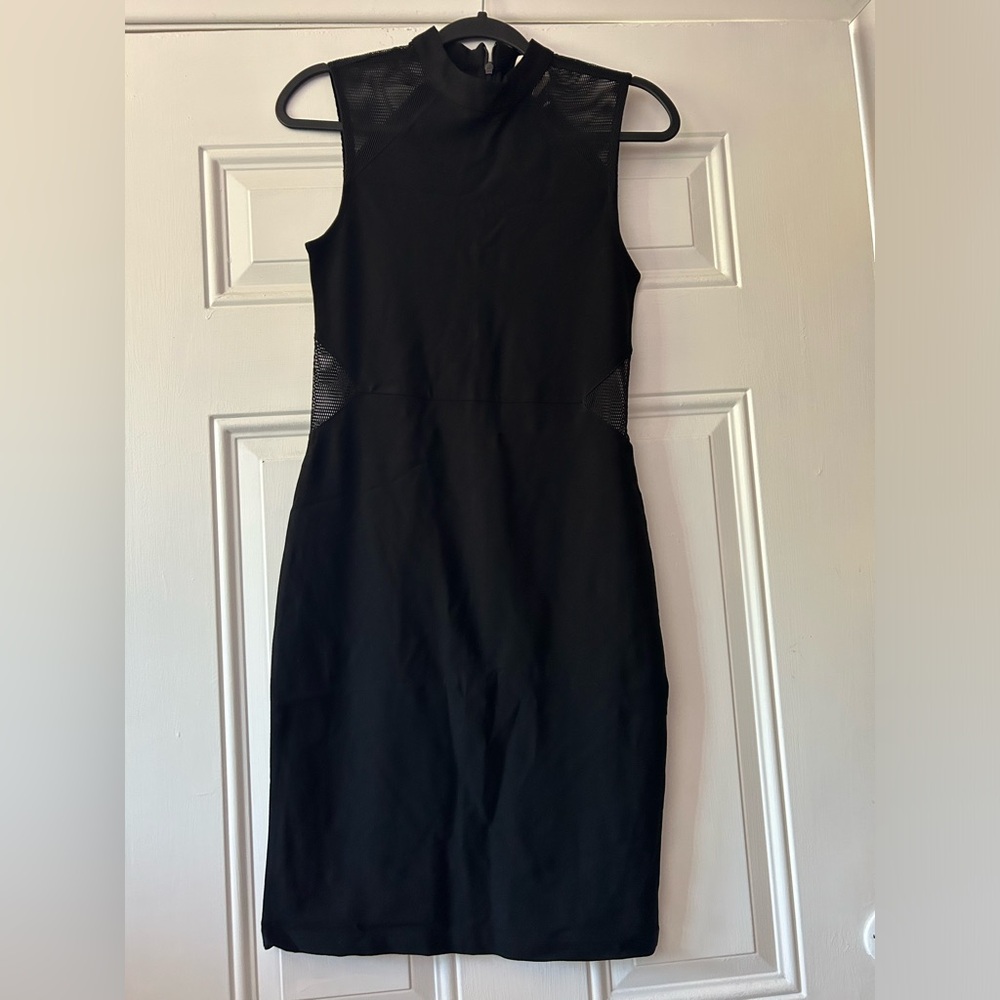 Black dress with mesh detailing on the sides